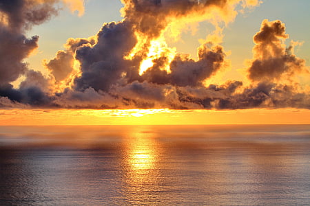 calm body of water during golden hour thumbnail