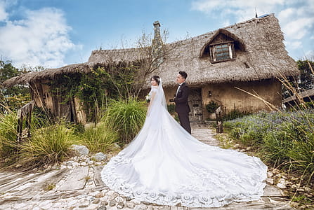 Man and Woman Wearing Wedding Outfits thumbnail