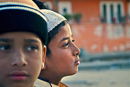 boy wearing white taqiyah thumbnail