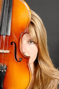 woman behind violin looking straight thumbnail