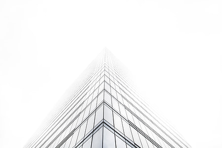 low angle photography of skyscraper under cloudy sky during daytime thumbnail