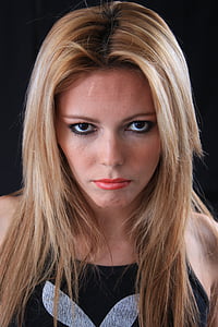 woman in blonde hair wearing black Playboy top thumbnail