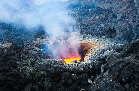 volcano lava surrounded with rock during daytime thumbnail