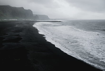 sea wave near mountain thumbnail