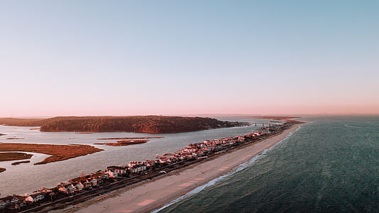 bird's-eye view of body of water across mountain thumbnail