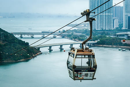 brown and gray cable car above sea thumbnail