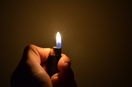 person clicking lit lighter thumbnail