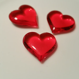 closeup photo of three red ceramic marbles thumbnail
