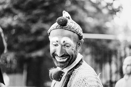 greyscale of man in clown makeup and clothes thumbnail