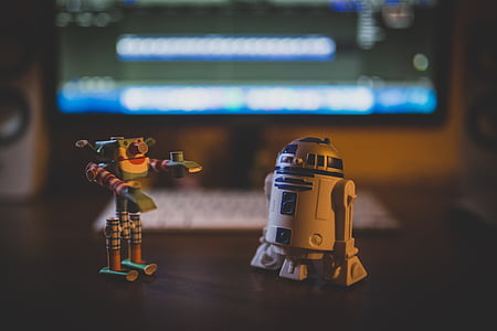 Star Wars R2-D2 toy figures on brown wooden table thumbnail