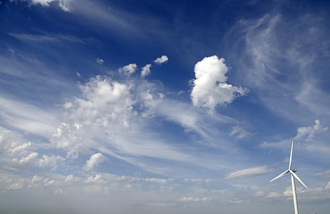 cumulus clouds over blue calm sky thumbnail