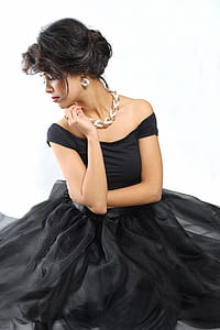 woman wearing black off-shoulder dress thumbnail