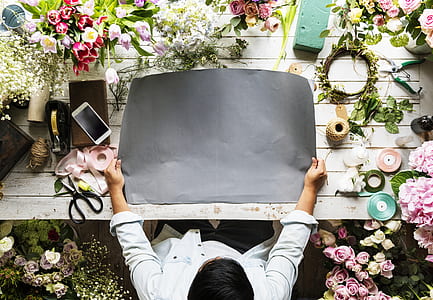 person holding gray mat on table thumbnail