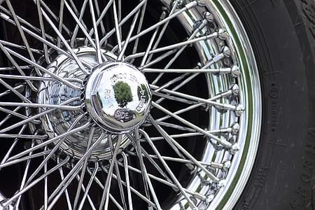 chrome-colored multi-spoke vehicle wheel and tire thumbnail