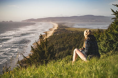 Woman on a slope by the shore thumbnail