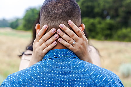 person wearing blue and white polka-dot shirt thumbnail
