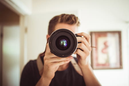 macro shot of black DSLR camera thumbnail