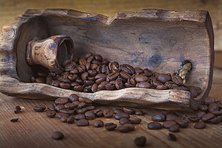 selective focus photography of coffee beans in brown wooden container thumbnail