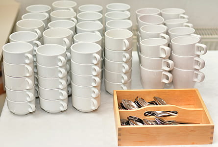 stack white ceramic teacup lot beside cutlery set thumbnail