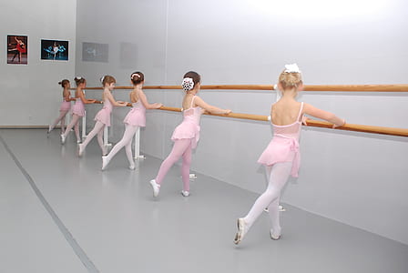ballerinas holding wood rail thumbnail