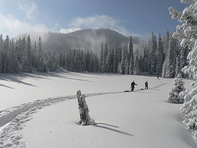 two person doing ice ski during daytime thumbnail