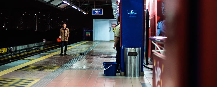 man standing in front of trainway thumbnail