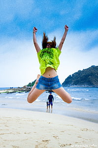 woman jumping in sand thumbnail