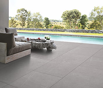 gray suede sofa set near swimming pool thumbnail