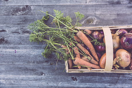 orange carrots and red onion on brown wicker basket thumbnail