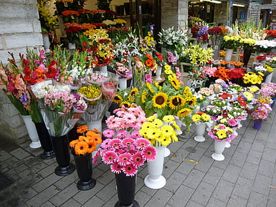 assorted-color petaled flowers outside store thumbnail
