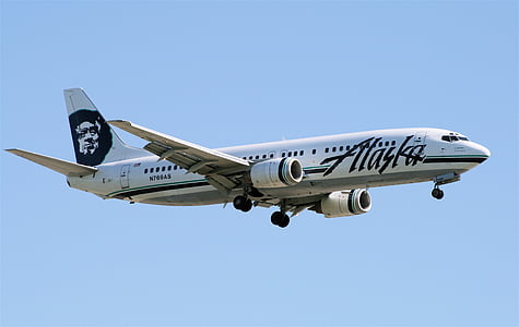 white Alaska airliner flying thumbnail