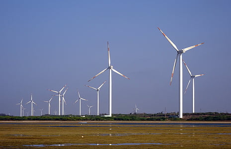 white windmills under blue sky during daytime thumbnail