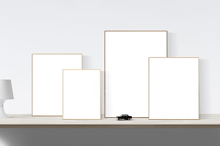 black car scale model beside rectangular white boards thumbnail