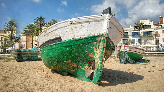 three green-and-white docked boats on shore thumbnail