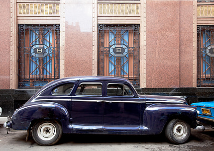 close-up photography of classic blue vehicle thumbnail
