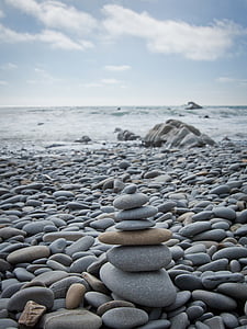 gray and brown 7-tier rock formation near body of water thumbnail