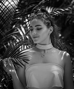 grayscale photo of woman wearing halter top thumbnail