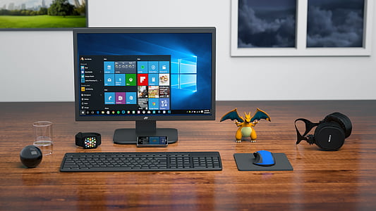 turned-on flat screen computer monitor, keyboard, and mouse thumbnail