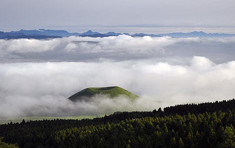 volcano surrounding by clouds at daytime thumbnail