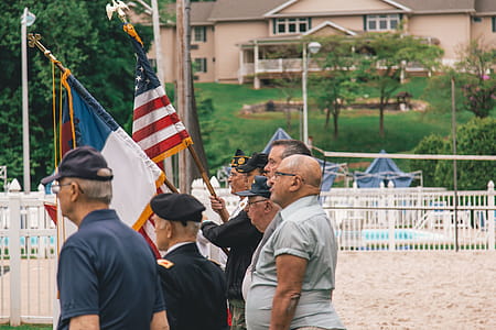 Men Standing Near Flags thumbnail