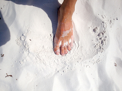 persons standing on white sand thumbnail