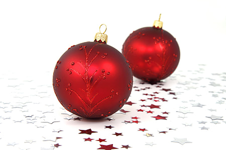 two red baubles on white surface thumbnail
