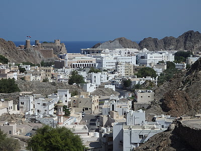 gray concrete buildings on mountain thumbnail