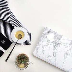 Clear Glass Cup With Tea on Table thumbnail
