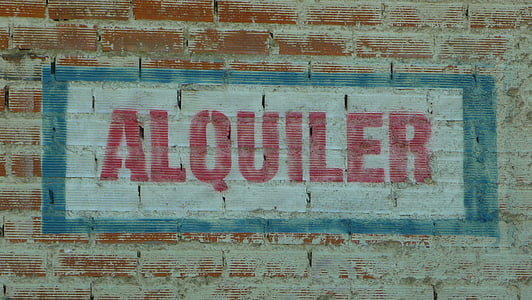 alquiler text on brick wall thumbnail