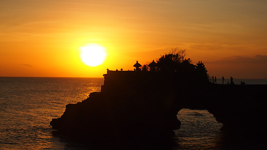 silhouette photography of building near cliff thumbnail