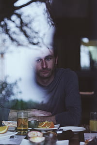 man sitting near dining table thumbnail