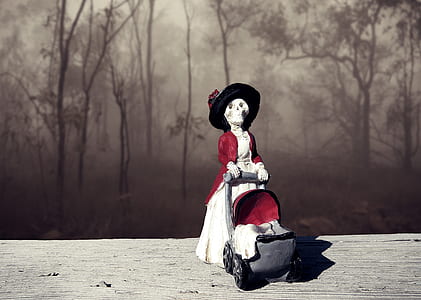 woman wearing white and red dress figurine thumbnail