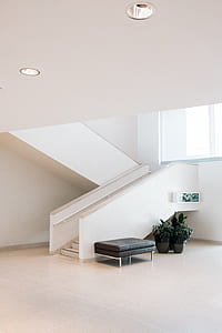 ottoman beside stair in house thumbnail