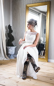 woman sitting on chair wearing wedding gown thumbnail